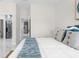 Main bedroom with a view of the ensuite bathroom and kitchen, featuring modern decor and marble floors at 12706 N Ola Ave, Tampa, FL 33612