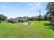 Expansive backyard with lush green grass, providing a tranquil and spacious outdoor retreat for relaxation and recreation at 12757 Circle Lake Dr, Hudson, FL 34669