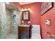 Modern bathroom with a glass sink, vanity, walk-in shower, and decorative accents creating a serene and stylish space at 12757 Circle Lake Dr, Hudson, FL 34669