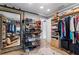 This spacious closet features custom storage for clothes, shoes and suitcases at 12757 Circle Lake Dr, Hudson, FL 34669