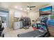 Bright exercise room features a sink, washer and dryer, and treadmill at 12757 Circle Lake Dr, Hudson, FL 34669
