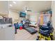 Bright exercise room features a sauna, treadmill, TV, utility sink and ceiling fan at 12757 Circle Lake Dr, Hudson, FL 34669