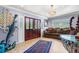 A vibrant foyer features a decorative marlin sculpture and a striking chandelier at 12757 Circle Lake Dr, Hudson, FL 34669