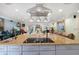 Open kitchen design with a large center island featuring a cooktop and bar seating at 12757 Circle Lake Dr, Hudson, FL 34669