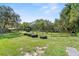 Expansive horse property with grazing areas, mature trees, and farm building providing space for animals at 12757 Circle Lake Dr, Hudson, FL 34669