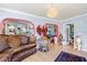 Spacious living room with hardwood floors, arched doorways, and elegant decor at 12757 Circle Lake Dr, Hudson, FL 34669