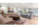 Open-concept living room and kitchen area with a large sofa and a modern island at 12757 Circle Lake Dr, Hudson, FL 34669