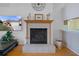 Close-up of the fireplace in the living room, with decorative mantle and tile surround at 150 Center Oak Cir, Spring Hill, FL 34609