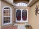 Close-up of the front entrance, showcasing the decorative double doors and stylish window at 150 Center Oak Cir, Spring Hill, FL 34609