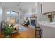 Bright living room with vaulted ceilings, a fireplace, and sliding glass doors to the outdoors at 150 Center Oak Cir, Spring Hill, FL 34609
