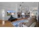Inviting living room with a fireplace, tv and open access to the kitchen and dining area at 150 Center Oak Cir, Spring Hill, FL 34609