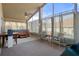 Well-lit sunroom with a hot tub, ceiling fan, and large windows at 150 Center Oak Cir, Spring Hill, FL 34609
