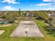 Enjoy a game of basketball in the community court with playground and green space at 1801 Loch Haven Ct, Trinity, FL 34655