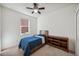 Cozy bedroom featuring a ceiling fan and built-in shelves for storage at 1801 Loch Haven Ct, Trinity, FL 34655