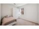 Well-lit bedroom includes a closet for storage and one window at 1801 Loch Haven Ct, Trinity, FL 34655