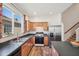 Well-lit kitchen features stainless steel appliances, wood cabinets, and a window overlooking the backyard at 1801 Loch Haven Ct, Trinity, FL 34655