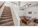 Inviting living room with high ceilings, staircase and fan at 1801 Loch Haven Ct, Trinity, FL 34655
