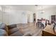 Inviting Living room with wood floors, large windows, neutral walls and a dining table at 1801 Loch Haven Ct, Trinity, FL 34655