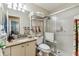 Well-maintained bathroom featuring a walk-in shower, granite countertop, and modern fixtures at 18515 Gentle Breeze Ct, Hudson, FL 34667