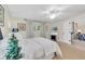 Bedroom with a ceiling fan, fireplace and natural light at 1911 Whitney Way, Clearwater, FL 33760