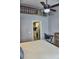 Open bedroom featuring decorative ladder and view of the kitchen at 1955 Abrico Dr # G12, Lutz, FL 33558
