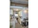 Efficient kitchen with white cabinets, granite countertops, and a cozy breakfast bar at 1955 Abrico Dr # G12, Lutz, FL 33558