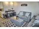 Inviting living area featuring a comfortable sofa and dining table with stools at 1955 Abrico Dr # G12, Lutz, FL 33558