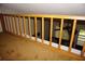 Loft view featuring wood railing and carpeted floor overlooking the living area at 1955 Abrico Dr # G12, Lutz, FL 33558