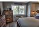 Comfortable main bedroom with rustic wood accents and ample natural light at 1955 Abrico Dr # G12, Lutz, FL 33558