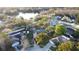 This aerial view showcases the property's location near a serene lake and lush greenery at 2233 Egret Walk Ct, New Port Richey, FL 34655