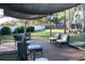 Backyard deck with modern seating and shade at 2233 Egret Walk Ct, New Port Richey, FL 34655