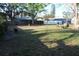 View of a spacious backyard with green grass at 2233 Egret Walk Ct, New Port Richey, FL 34655