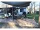 Backyard deck with shade and patio furniture at 2233 Egret Walk Ct, New Port Richey, FL 34655