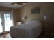Bright bedroom features light-colored walls and french doors to the lanai at 2233 Egret Walk Ct, New Port Richey, FL 34655