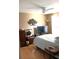 Bedroom with neutral tones, modern ceiling fan, and wood-look flooring at 2233 Egret Walk Ct, New Port Richey, FL 34655