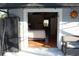 View into the bedroom with sliding door entry from patio and a ceiling fan at 2233 Egret Walk Ct, New Port Richey, FL 34655