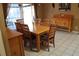 Traditional dining room features a wooden table set for six and tiled floors at 2233 Egret Walk Ct, New Port Richey, FL 34655