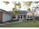 Well-kept lawn and covered entryway create a welcoming facade for this home at 2233 Egret Walk Ct, New Port Richey, FL 34655