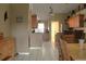 Open-concept kitchen and dining area features tile flooring and modern cabinetry at 2233 Egret Walk Ct, New Port Richey, FL 34655