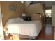 Cozy main bedroom features stairs, a dresser and a view into the Primary bath at 2233 Egret Walk Ct, New Port Richey, FL 34655