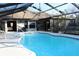 Sparkling swimming pool featuring a screened enclosure and access to the home at 2233 Egret Walk Ct, New Port Richey, FL 34655
