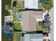 Aerial view of the home featuring a spacious yard, screened-in pool, dock, and boat lift at 3228 Jackson Dr, Holiday, FL 34691