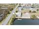 Aerial view of the property showing the private dock with the waterfront and its neighborhood at 3449 Companero Entra, Hernando Beach, FL 34607