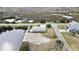Aerial view of the property featuring the waterfront access, dock, and surrounding landscape and neighborhood at 3449 Companero Entra, Hernando Beach, FL 34607