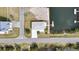 An aerial view of a single-story home featuring a private boat dock on a canal and an outlined red property line at 3449 Companero Entra, Hernando Beach, FL 34607