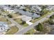 Inviting single-story home with a waterfront view, large driveway, and serene landscaping at 3449 Companero Entra, Hernando Beach, FL 34607