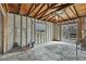 Interior of home under construction with exposed framing, ceiling and concrete floor at 3449 Companero Entra, Hernando Beach, FL 34607