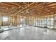 Interior of home under construction with exposed framing, ceiling and concrete floor at 3449 Companero Entra, Hernando Beach, FL 34607