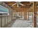 Interior of home under construction with exposed framing, ceiling and concrete floor at 3449 Companero Entra, Hernando Beach, FL 34607