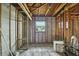 Interior of home under construction with exposed framing, ceiling and concrete floor at 3449 Companero Entra, Hernando Beach, FL 34607